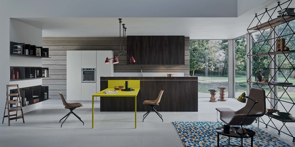Design ideas for a mid-sized modern galley open plan kitchen in New York with an undermount sink, flat-panel cabinets, dark wood cabinets, solid surface benchtops, stainless steel appliances, concrete floors and with island.
