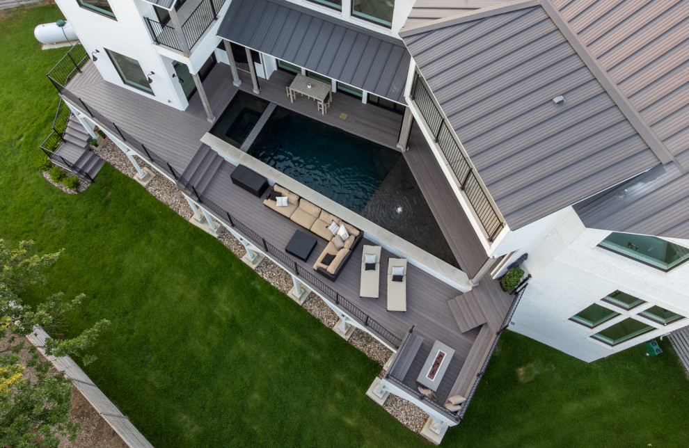 Photo of a small farmhouse roof private and custom shaped above ground swimming pool in Dallas with decking.