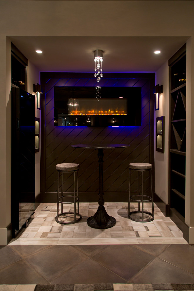 Photo of a small transitional wine cellar in Kansas City with ceramic floors and storage racks.