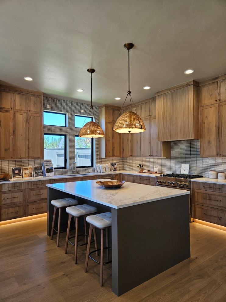 Kitchen - transitional kitchen idea with light wood cabinets, an island and white countertops