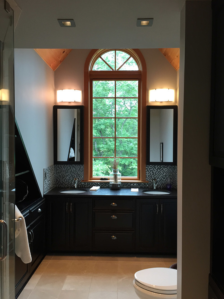 Mid-sized transitional master beige floor bathroom photo with black cabinets, gray walls, an undermount sink and soapstone countertops