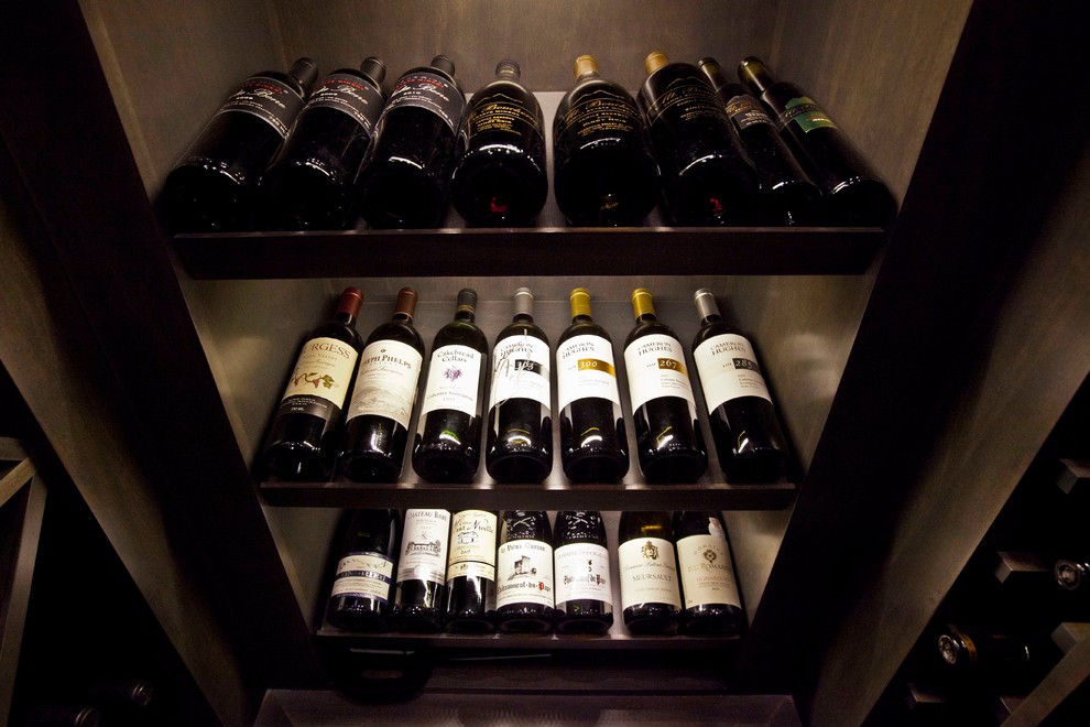 Photo of a transitional wine cellar in Calgary.