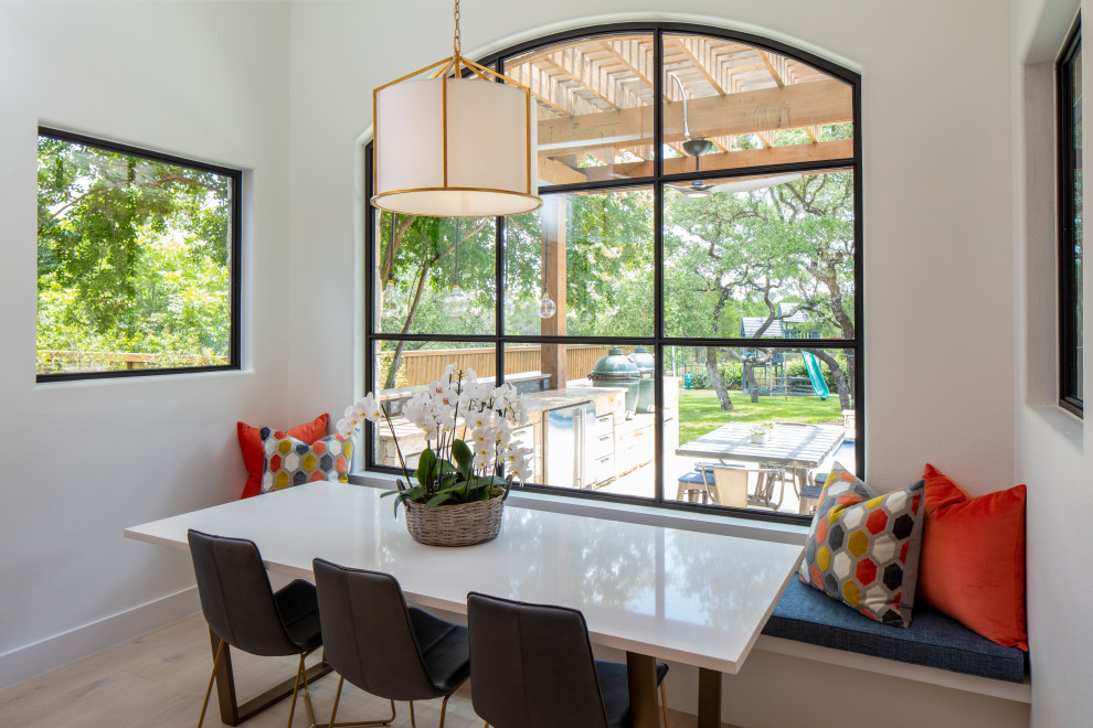 Kitchen/dining room combo - large transitional light wood floor and beige floor kitchen/dining room combo idea in Austin with white walls and no fireplace
