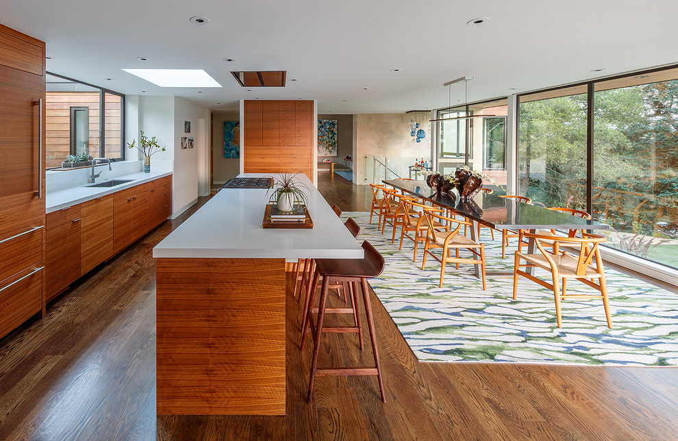 Design ideas for an expansive midcentury single-wall eat-in kitchen in San Francisco with a drop-in sink, flat-panel cabinets, medium wood cabinets, quartz benchtops, white splashback, stone slab splashback, panelled appliances, medium hardwood floors, with island and turquoise floor.