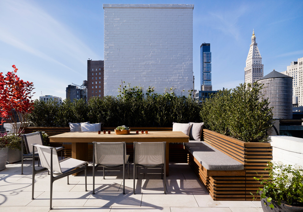 Contemporary rooftop and rooftop deck in New York with no cover.