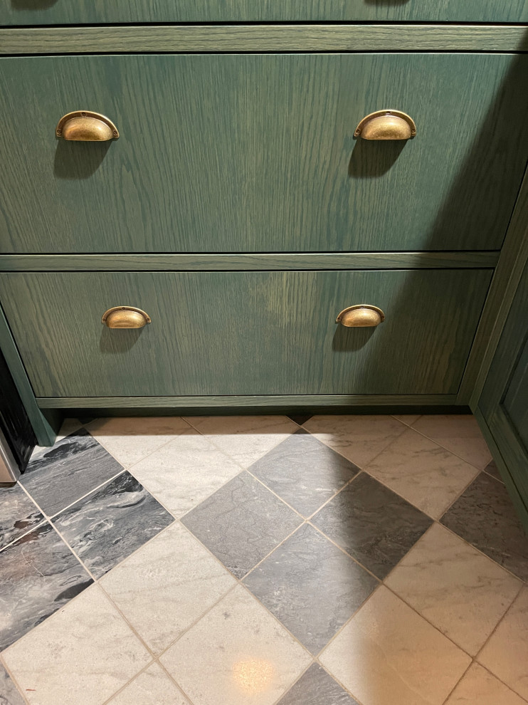 Inspiration for a mid-sized transitional marble floor and multicolored floor kitchen remodel with green cabinets, quartz countertops, white backsplash, quartz backsplash, stainless steel appliances and white countertops