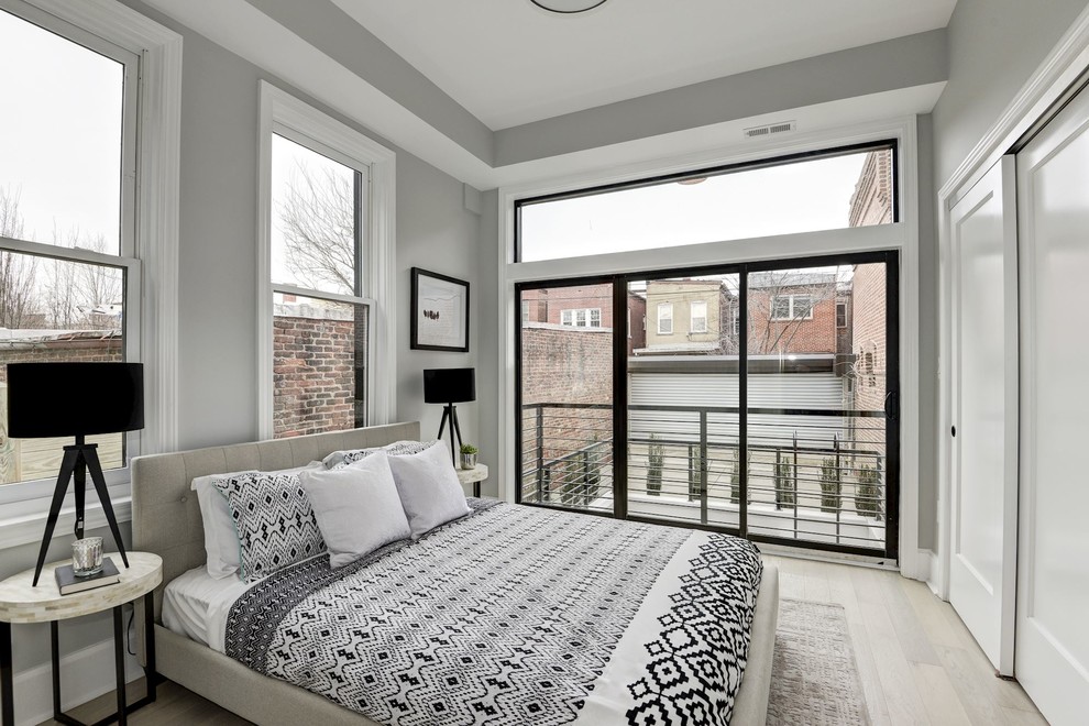 Inspiration for a transitional bedroom in DC Metro with grey walls, light hardwood floors and beige floor.