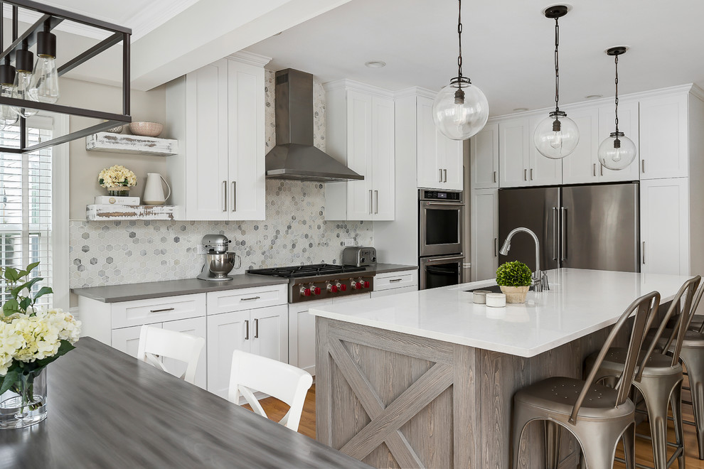 Example of a large transitional light wood floor open concept kitchen design in Chicago with an undermount sink, shaker cabinets, white cabinets, quartz countertops, gray backsplash, marble backsplash, stainless steel appliances and an island
