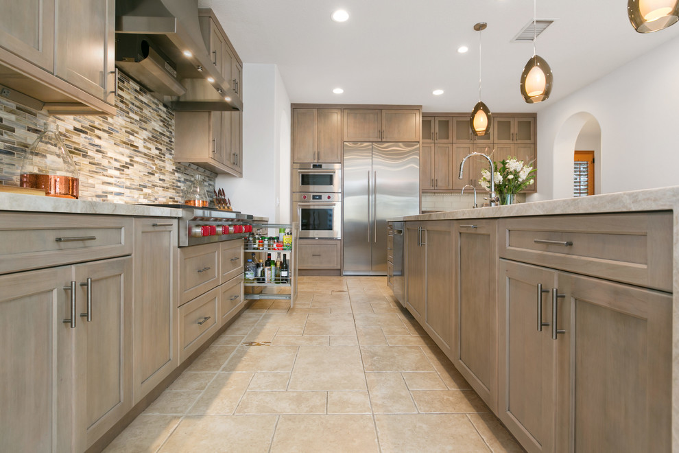 This is an example of a large transitional l-shaped open plan kitchen in San Diego with recessed-panel cabinets, grey cabinets, quartzite benchtops, with island and beige benchtop.