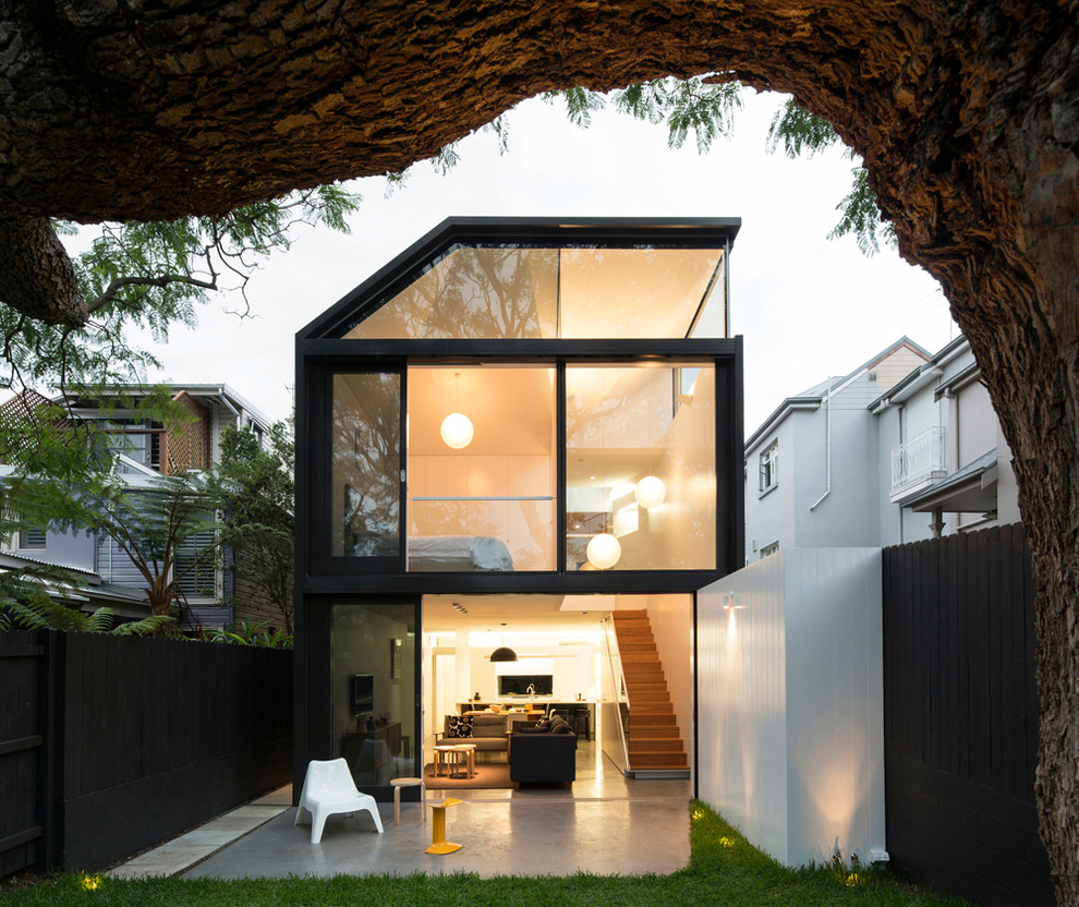 Photo of a mid-sized contemporary two-storey black exterior in Sydney.