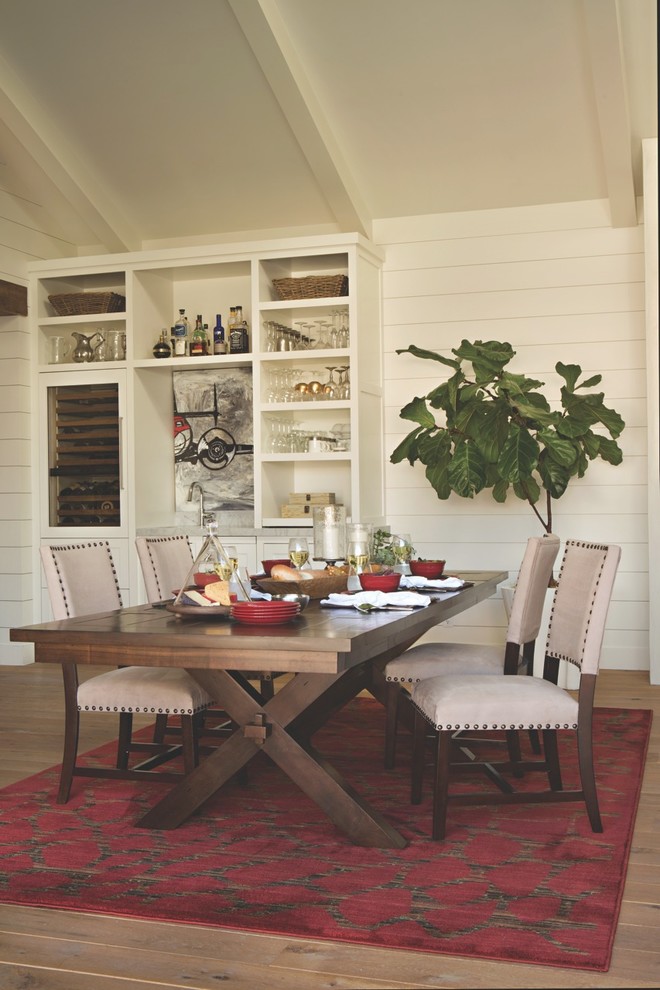 Inspiration for a mid-sized separate dining room in Los Angeles with white walls, light hardwood floors and no fireplace.