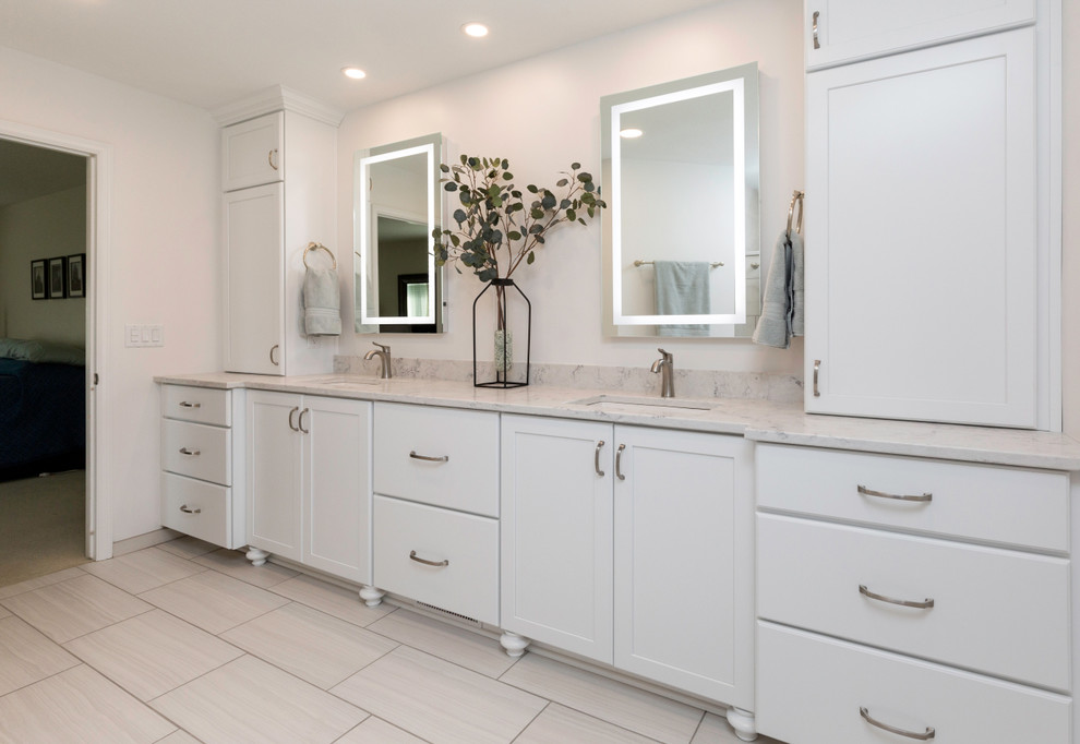 Mid-sized transitional master bathroom in Other with recessed-panel cabinets, white cabinets, an open shower, a two-piece toilet, white walls, ceramic floors, an undermount sink, engineered quartz benchtops, grey floor, an open shower and white benchtops.