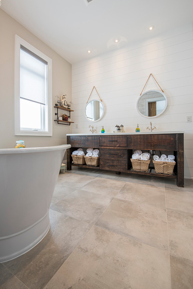 This is an example of a mid-sized modern master bathroom in Toronto with flat-panel cabinets, white cabinets, a freestanding tub, a corner shower, a one-piece toilet, multi-coloured tile, white walls, an undermount sink, engineered quartz benchtops and a hinged shower door.
