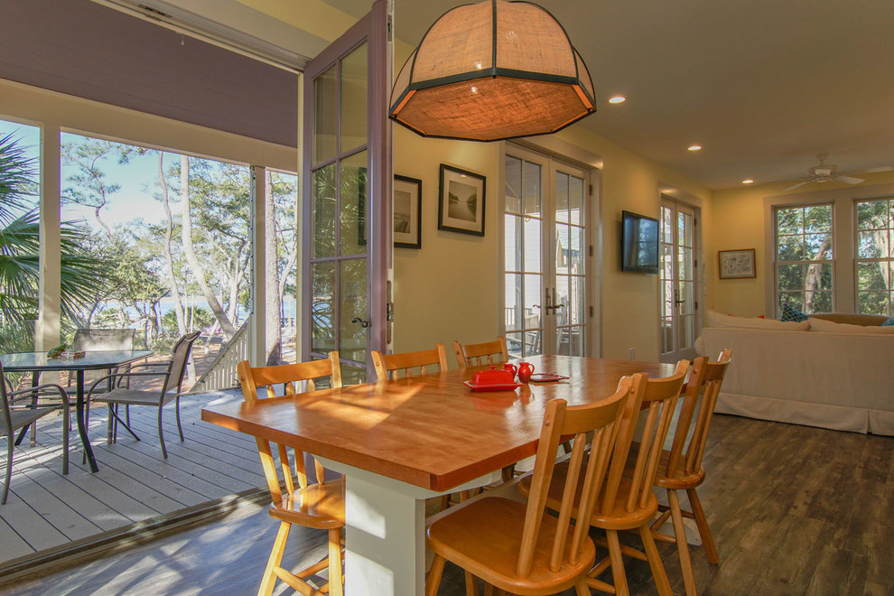 Inspiration for a mid-sized beach style open plan dining in Charleston with dark hardwood floors.