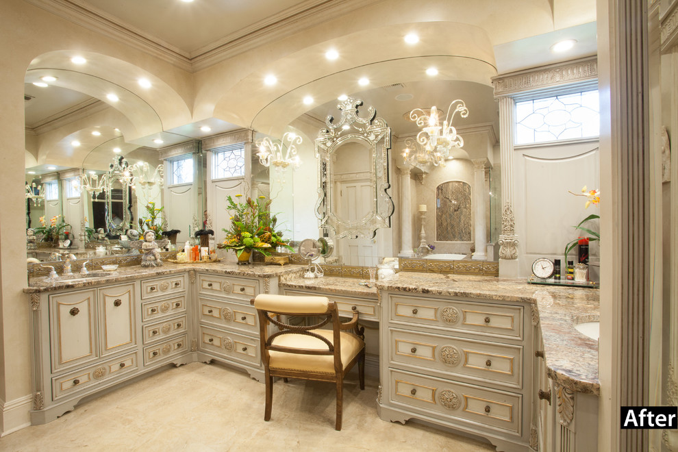 Photo of a large mediterranean master bathroom in New Orleans with furniture-like cabinets, grey cabinets, granite benchtops, beige tile, ceramic tile, an undermount sink, beige walls and ceramic floors.