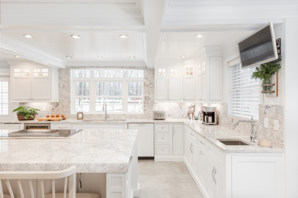 Example of a large transitional l-shaped ceramic tile and gray floor eat-in kitchen design with an undermount sink, beaded inset cabinets, white cabinets, quartz countertops, multicolored backsplash, quartz backsplash, stainless steel appliances, an island and multicolored countertops