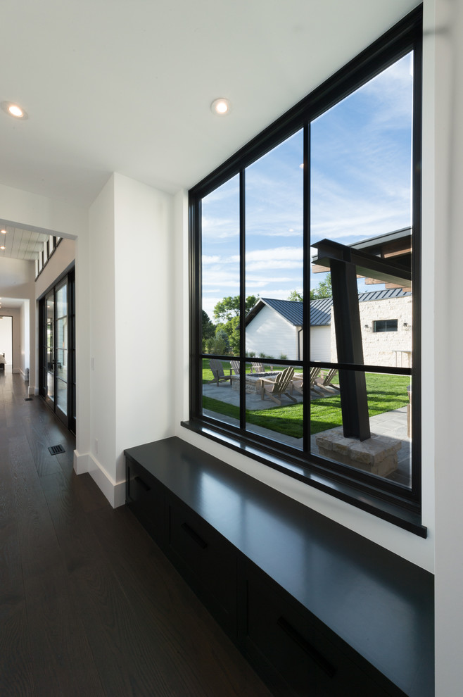 Example of a transitional home design design in Denver