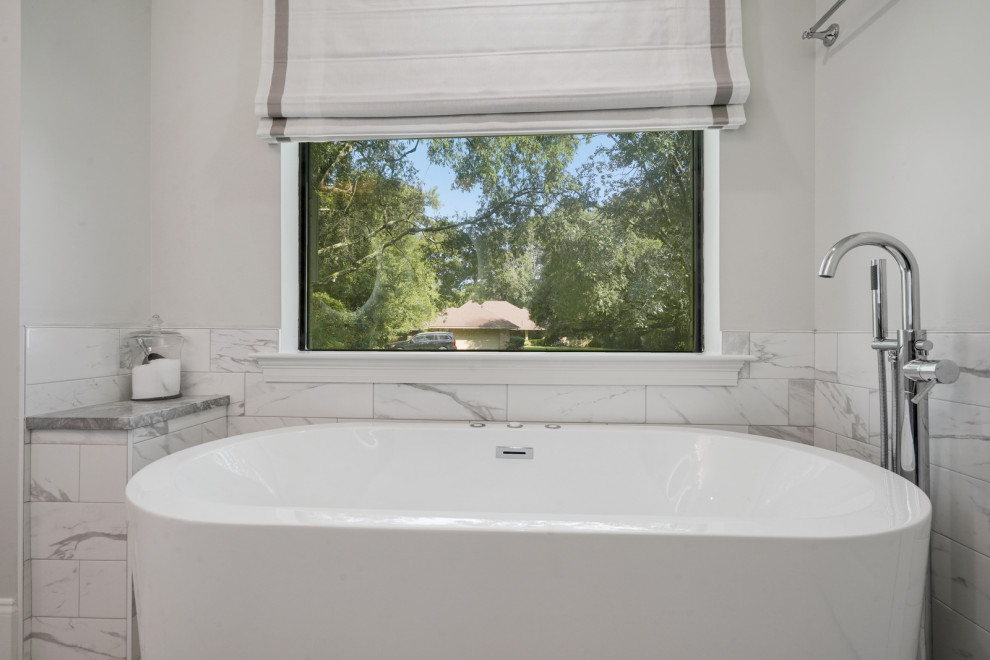 Photo of a large transitional master bathroom in New Orleans with flat-panel cabinets, grey cabinets, a freestanding tub, a double shower, white tile, marble, white walls, marble floors, an undermount sink, engineered quartz benchtops, white floor, a hinged shower door, grey benchtops, a shower seat, a single vanity and a built-in vanity.