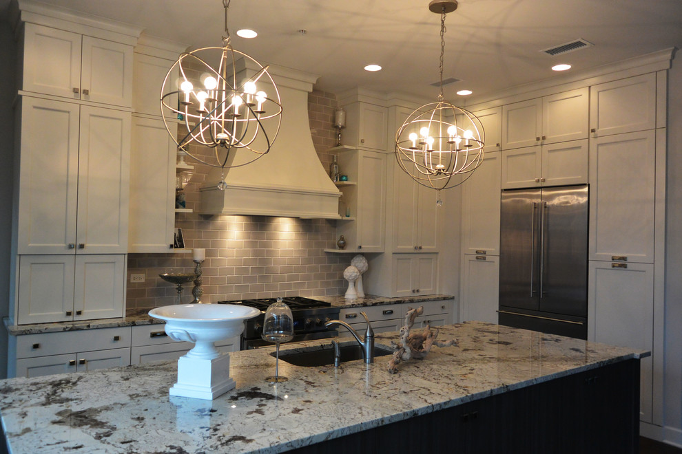 Inspiration for a transitional l-shaped eat-in kitchen remodel in Chicago with a single-bowl sink, recessed-panel cabinets, white cabinets, quartzite countertops, gray backsplash, subway tile backsplash and stainless steel appliances