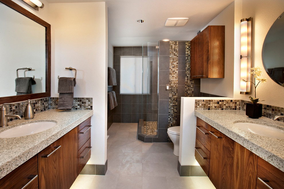 Design ideas for a mid-sized modern master bathroom in Boise with an undermount sink, medium wood cabinets, terrazzo benchtops, an open shower, multi-coloured tile, glass tile and porcelain floors.