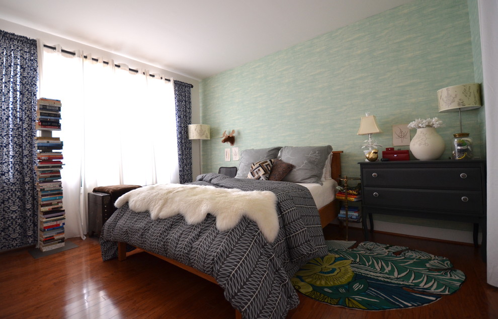 This is an example of a modern master bedroom in DC Metro with green walls and dark hardwood floors.