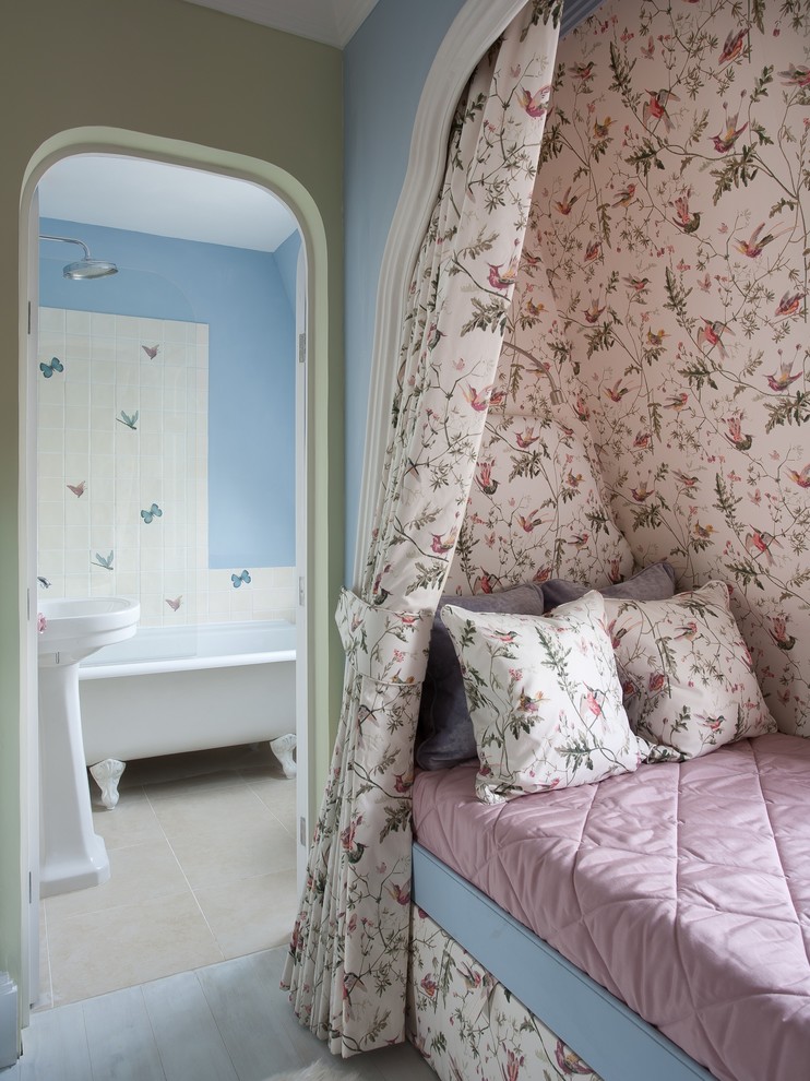 Inspiration for a large traditional kids' bedroom for kids 4-10 years old and girls in London with multi-coloured walls and painted wood floors.