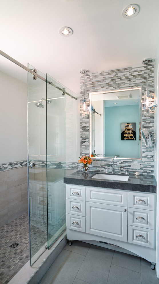 Mid-sized contemporary master bathroom in San Francisco with an undermount sink, raised-panel cabinets, white cabinets, engineered quartz benchtops, an alcove shower, a one-piece toilet, blue tile, mosaic tile, blue walls and porcelain floors.