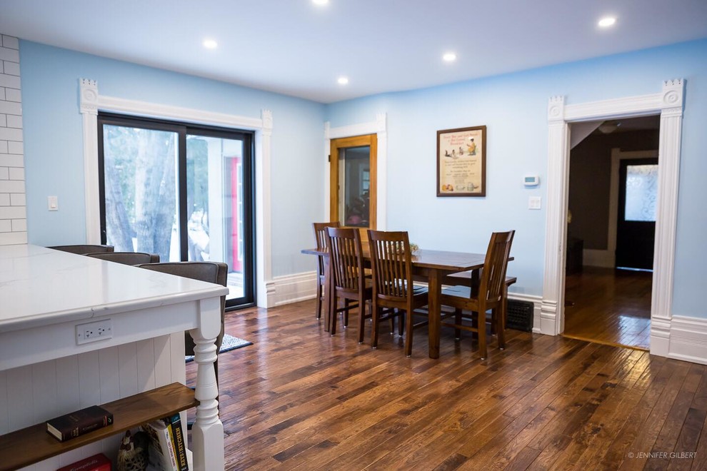 This is an example of a large traditional kitchen/dining combo in Toronto with medium hardwood floors and brown floor.