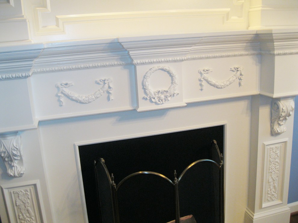 Example of a mid-sized classic dark wood floor kitchen/dining room combo design in DC Metro with blue walls and a standard fireplace