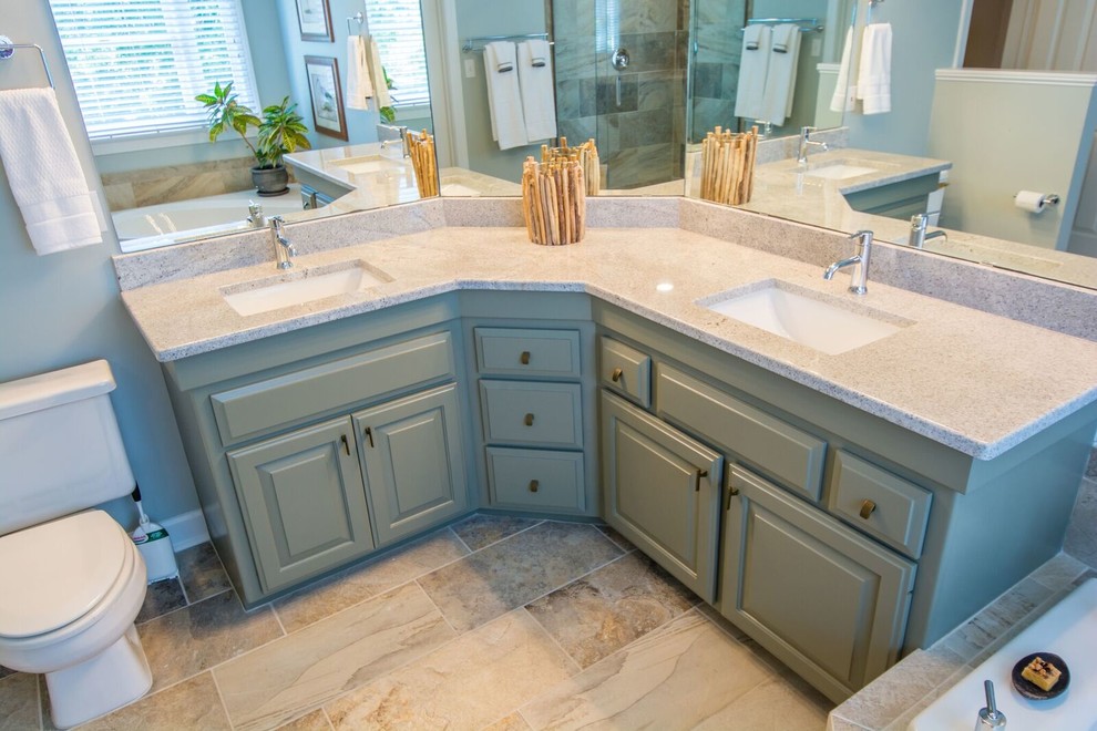 Inspiration for a large transitional master bathroom in Raleigh with raised-panel cabinets, green cabinets, a drop-in tub, a corner shower, a two-piece toilet, multi-coloured tile, stone slab, green walls, slate floors, an undermount sink and laminate benchtops.