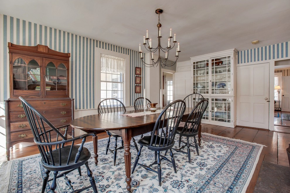 Design ideas for a traditional separate dining room in Boston with blue walls, dark hardwood floors and brown floor.