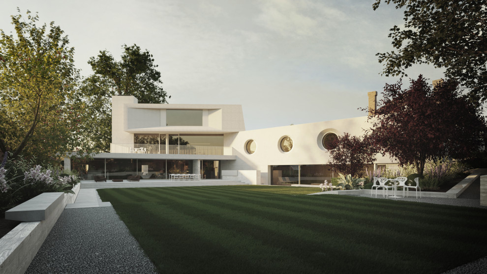 Cette image montre une très grande façade de maison grise minimaliste en béton à deux étages et plus avec un toit plat et un toit végétal.