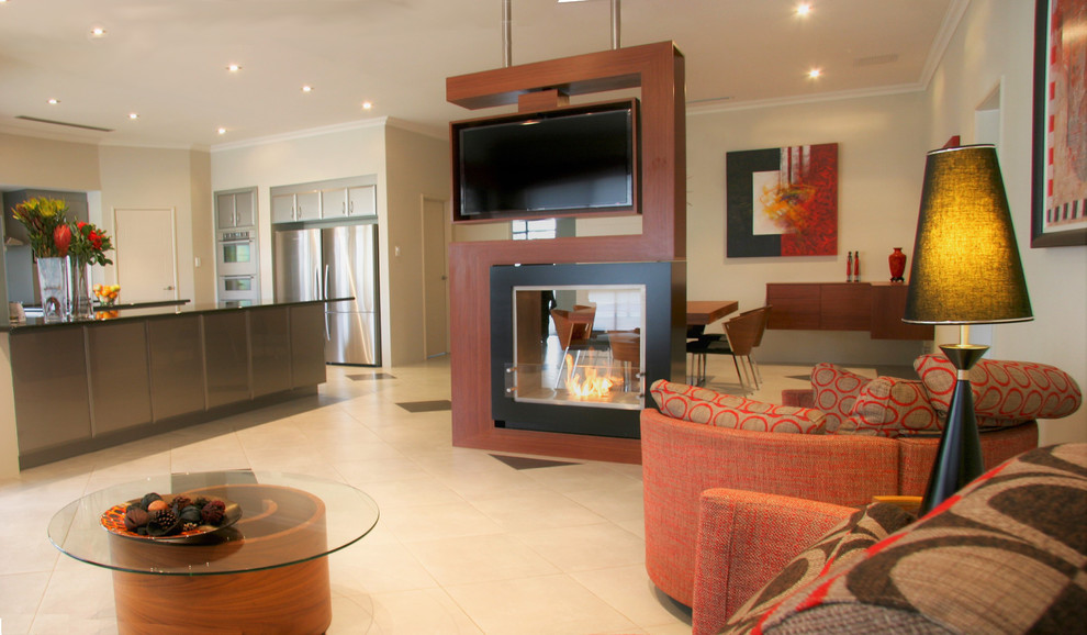 This is an example of a large contemporary formal open concept living room in Perth with white walls, ceramic floors, a two-sided fireplace, a wood fireplace surround, no tv and white floor.