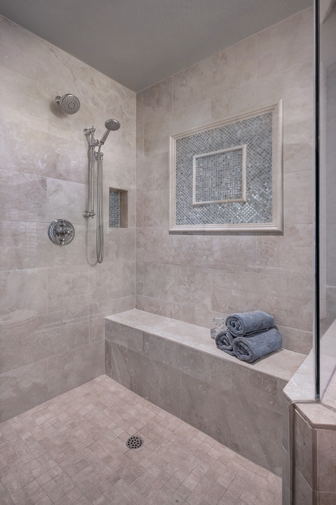 Inspiration for a mid-sized transitional master beige tile and stone tile porcelain tile drop-in bathtub remodel in Orange County with shaker cabinets, white cabinets, a one-piece toilet, gray walls, an undermount sink and quartz countertops