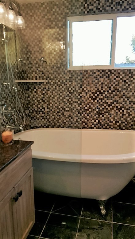 Photo of a small traditional 3/4 bathroom in Orange County with shaker cabinets, distressed cabinets, a claw-foot tub, a shower/bathtub combo, a one-piece toilet, beige tile, black tile, brown tile, mosaic tile, brown walls, ceramic floors, an undermount sink, granite benchtops, multi-coloured floor and an open shower.