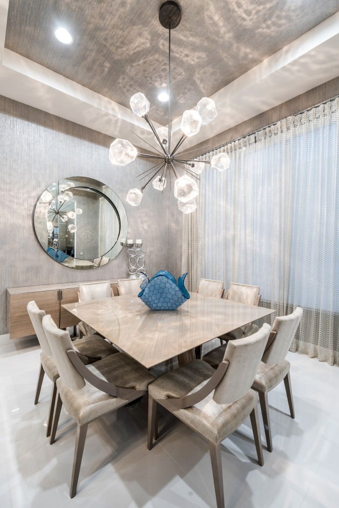 This is an example of a large contemporary open plan dining room in Miami with metallic walls, marble flooring, white floors, a wallpapered ceiling and wallpapered walls.