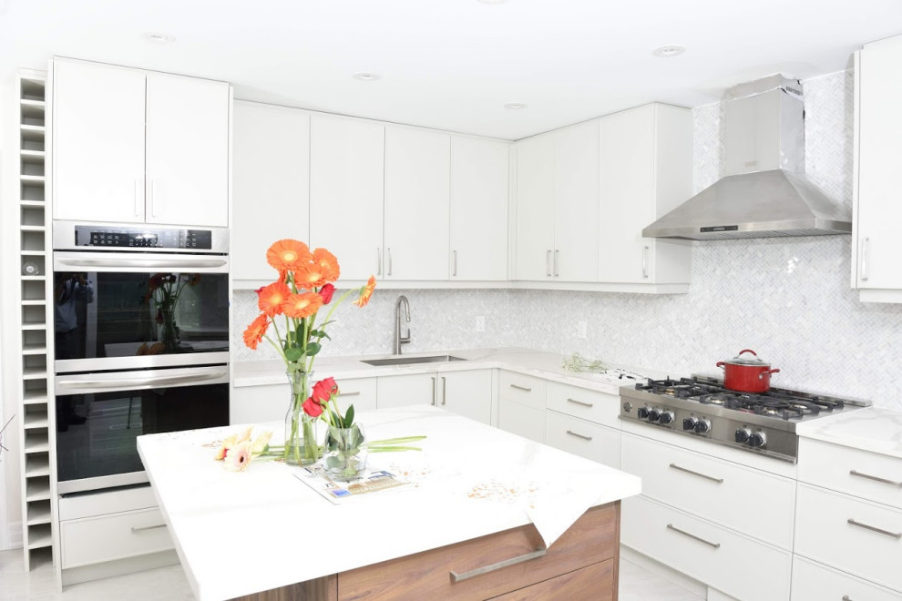 Inspiration for a mid-sized u-shaped light wood floor and white floor open concept kitchen remodel in Toronto with an undermount sink, shaker cabinets, gray cabinets, quartzite countertops, white backsplash, metal backsplash, stainless steel appliances, an island and white countertops