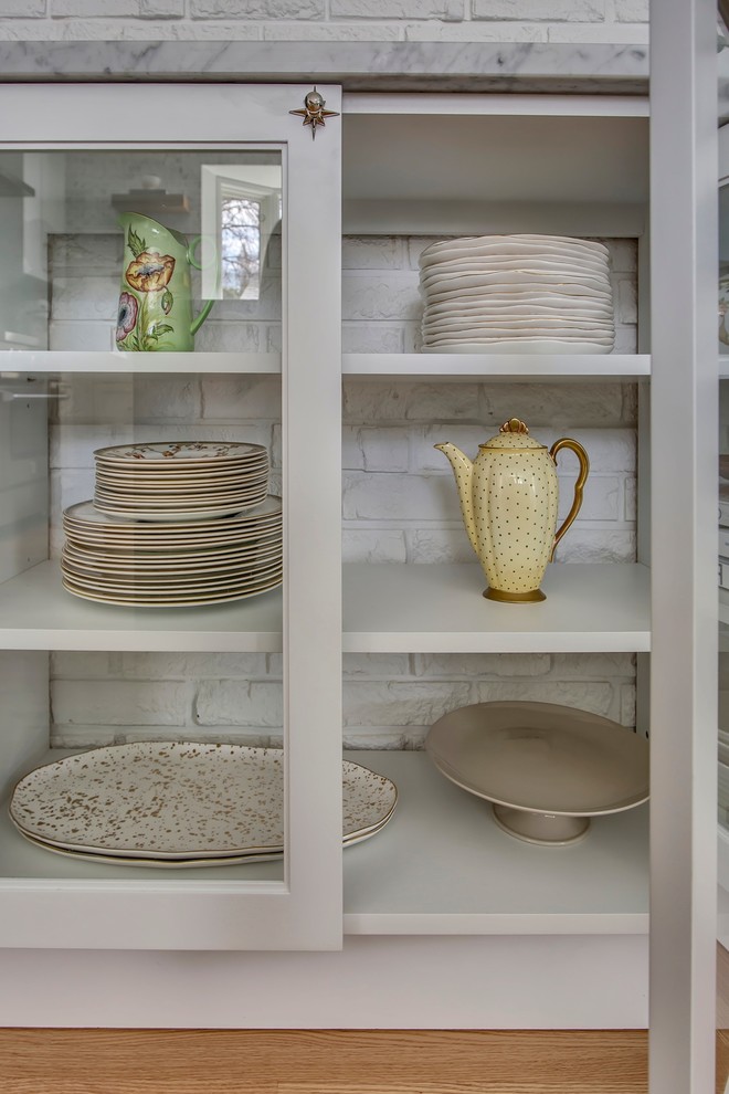 Example of a transitional kitchen design in Calgary