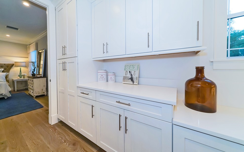 Inspiration for an arts and crafts laundry room in Tampa with shaker cabinets, white cabinets and quartzite benchtops.