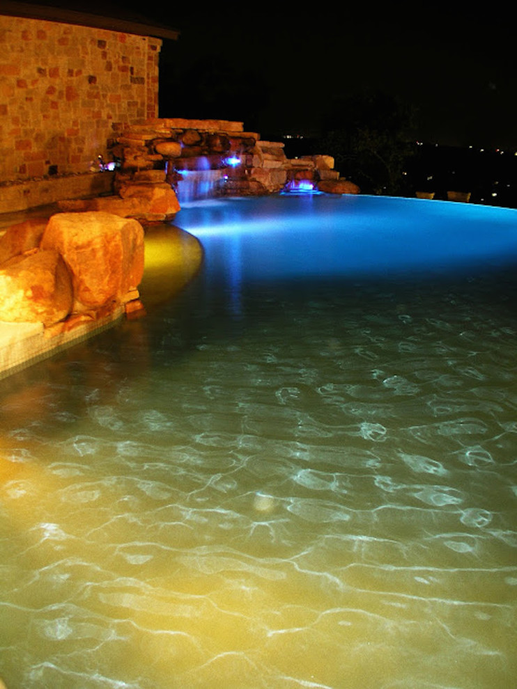 Inspiration for an infinity pool fountain remodel in Austin