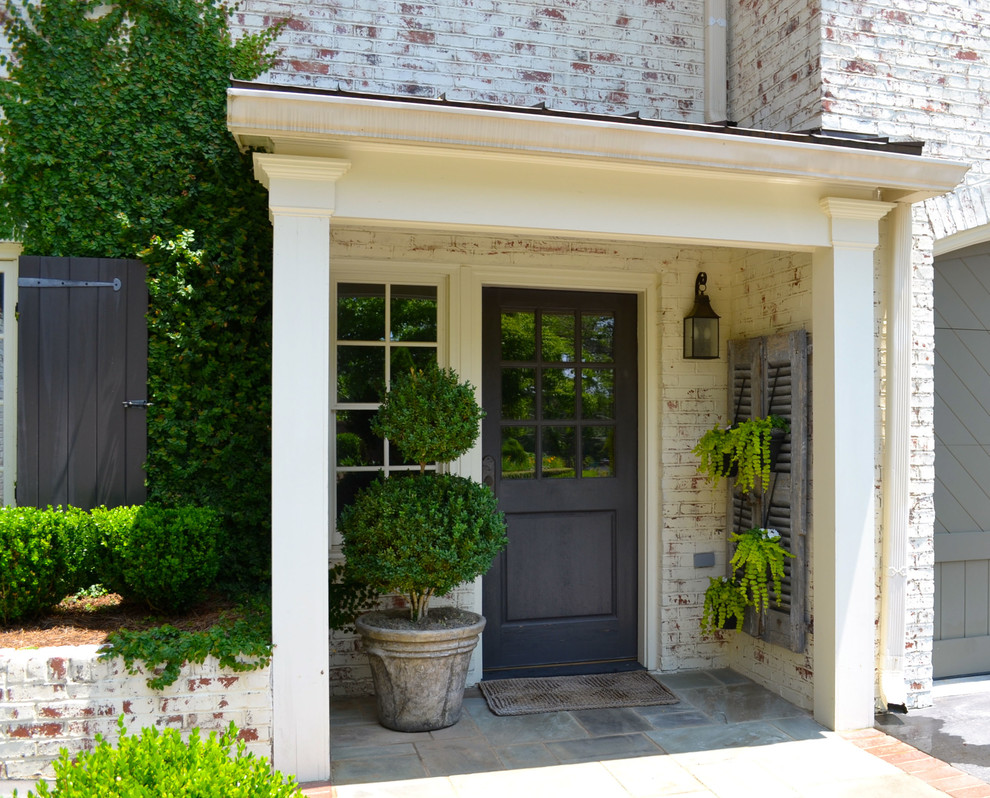 Photo of a traditional entryway in Atlanta with a black front door.