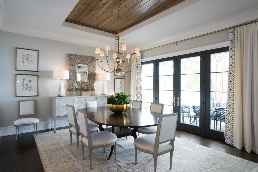 Design ideas for a transitional separate dining room in Other with dark hardwood floors, brown floor and beige walls.