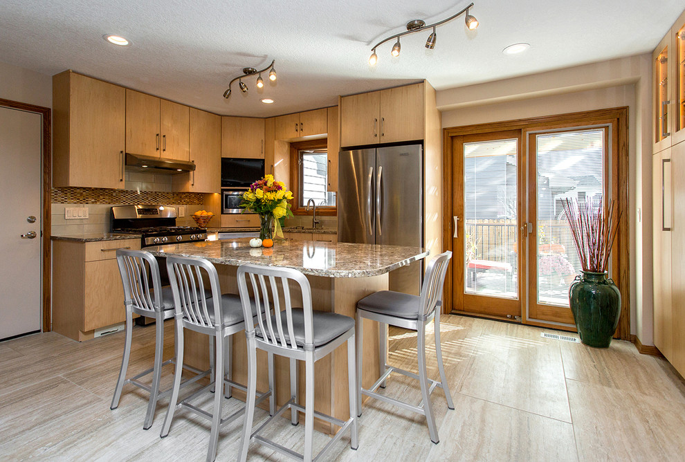 Example of a mid-sized transitional l-shaped porcelain tile open concept kitchen design with an undermount sink, flat-panel cabinets, light wood cabinets, beige backsplash, stainless steel appliances, an island, quartz countertops and porcelain backsplash