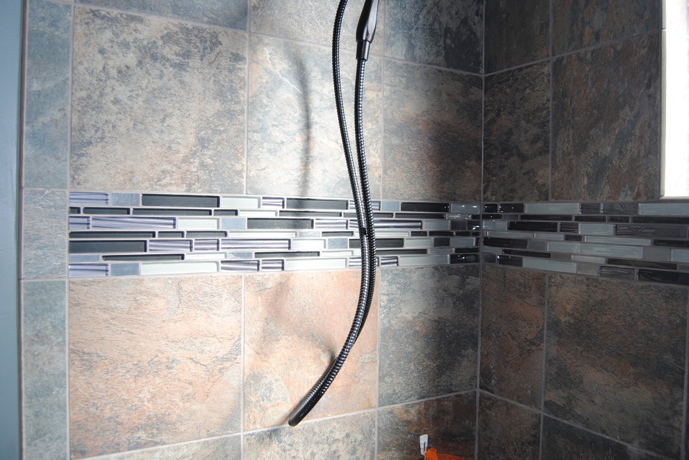 Mountain style multicolored tile and mosaic tile tub/shower combo photo in Denver