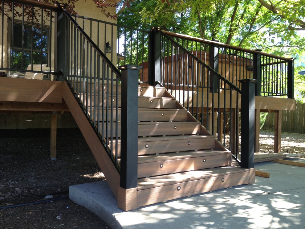 Large transitional backyard deck photo in Denver with no cover