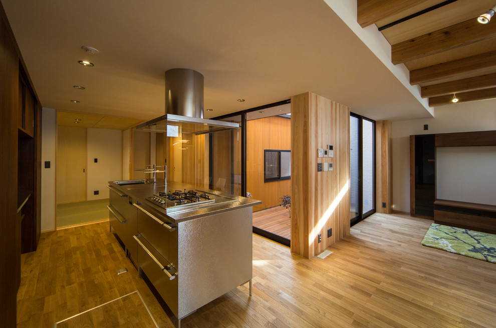 他の地域にあるアジアンスタイルのおしゃれなキッチンの写真