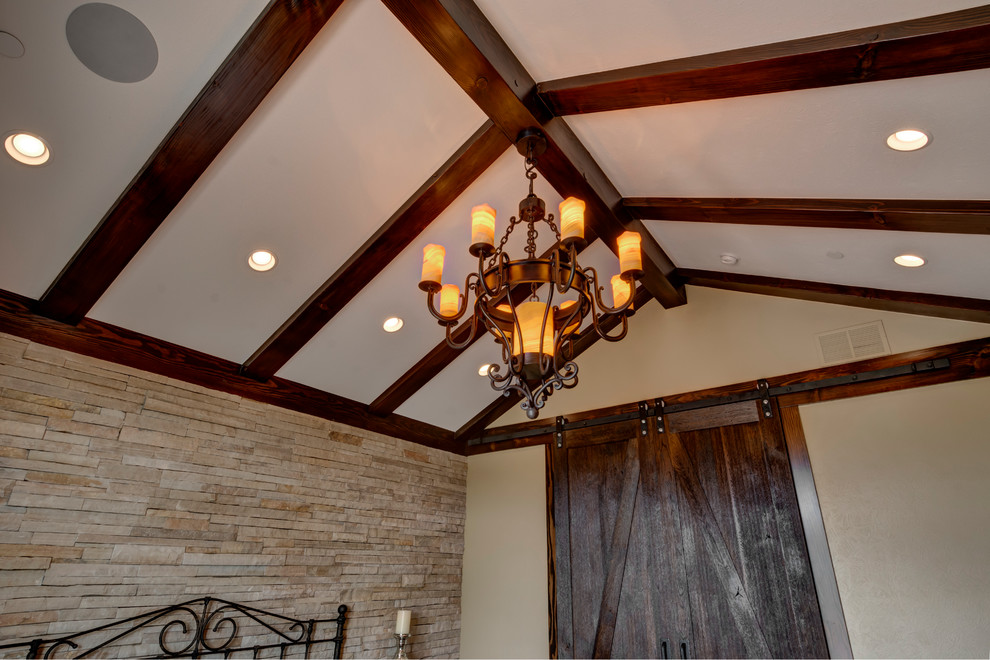 Mid-sized elegant master medium tone wood floor bedroom photo in Denver with beige walls and no fireplace