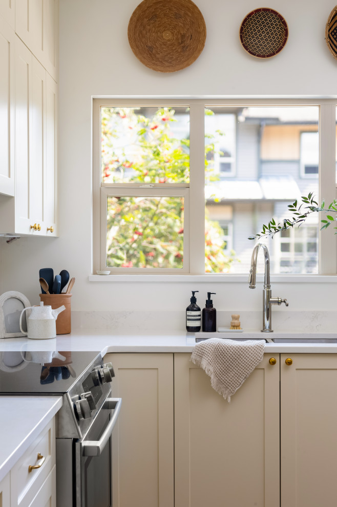 Example of a transitional kitchen design in Vancouver