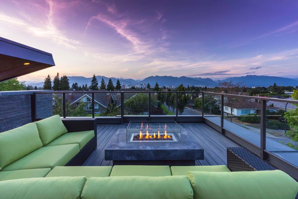 Design ideas for a contemporary rooftop and rooftop deck in Vancouver with a fire feature and no cover.