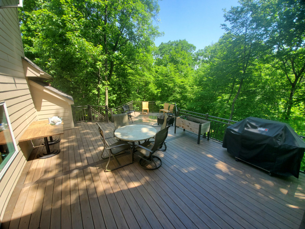 Deck - large backyard ground level metal railing deck idea with no cover
